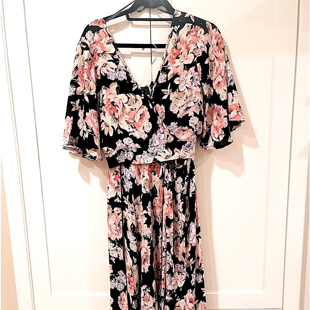 Cropped blouse, matching wrap long skirt. Black with pink floral pattern.